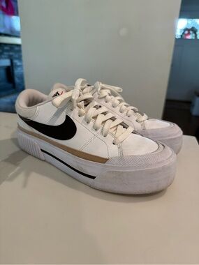 Nike White Platform Sneakers with Black Swoosh and Tan Stripe